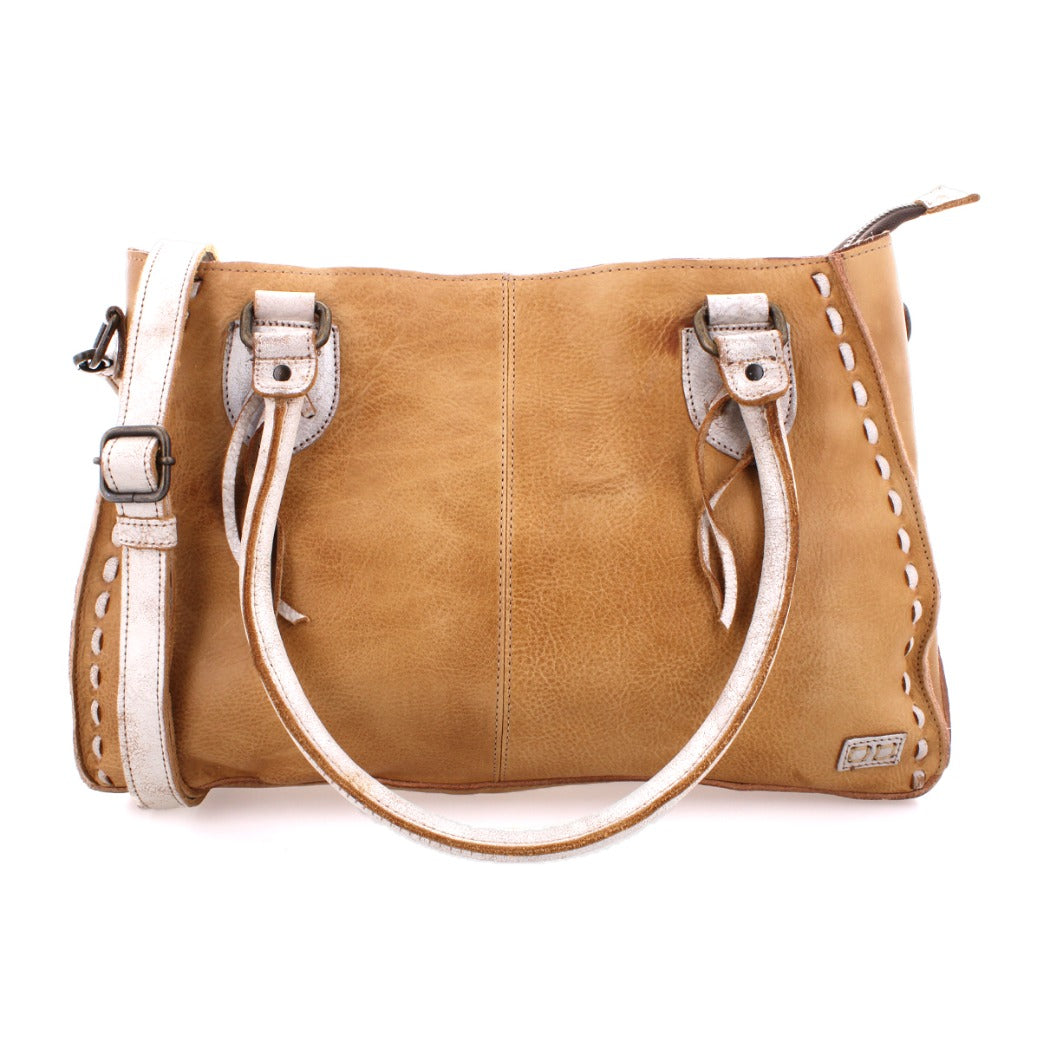 Rockababy by Bed|Stü is a tan leather handbag featuring white stitching details, double handles, and an adjustable crossbody strap, expertly crafted from premium vegetable-tanned leather and displayed against a white background.