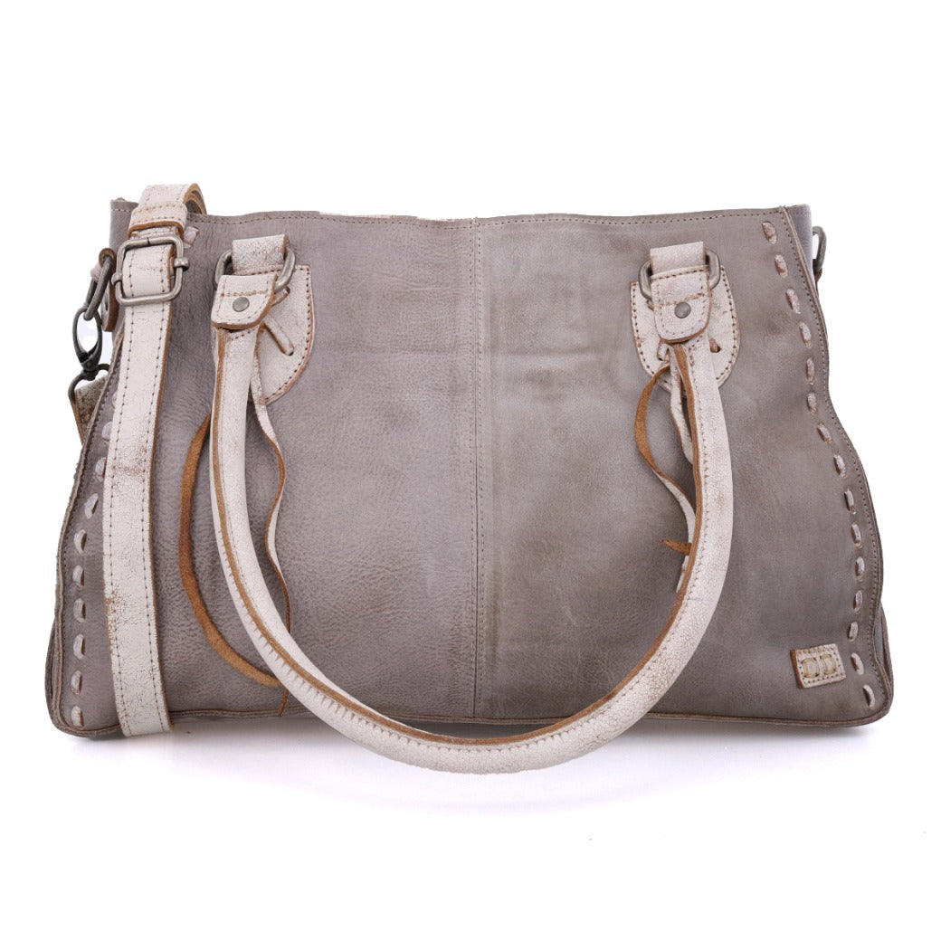 Introducing the Rockababy by Bed|Stü—a compact gray leather bag featuring double handles, decorative stitching along the edges, and a detachable crossbody strap for versatile carrying options.