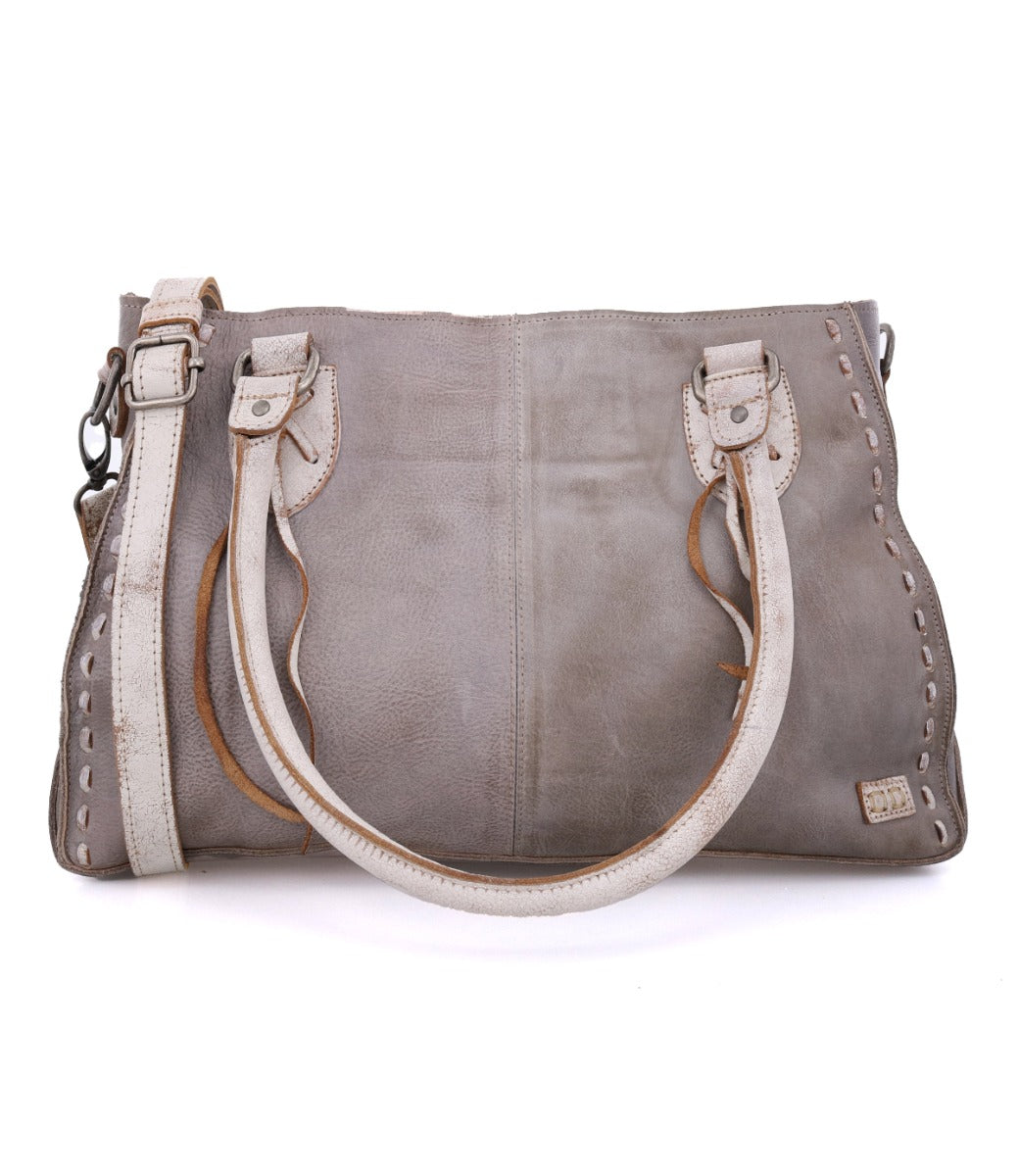 Introducing the Rockababy by Bed|Stü—a compact gray leather bag featuring double handles, decorative stitching along the edges, and a detachable crossbody strap for versatile carrying options.