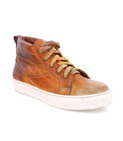 The Bed|Stü Rossela features a brown leather high-top design with tan laces and a white rubber sole, showcased on a white background—these comfortable sneakers blend premium materials and versatile style, perfect for everyday wear.