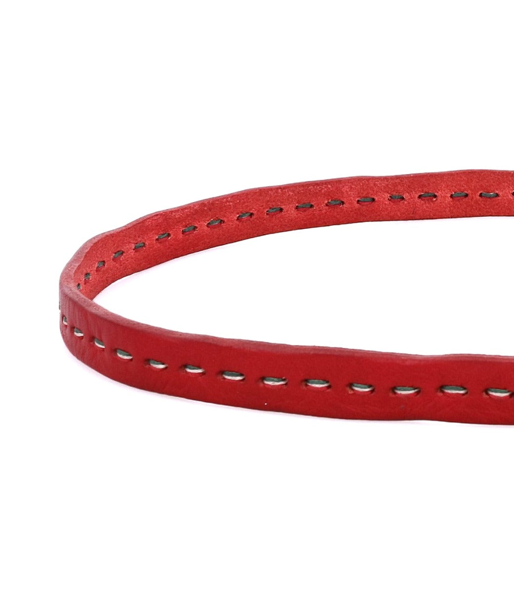 A close-up of the Bed|Stü Ruby smooth red leather strap showcases visible contrast stitching along the edge, set against a white background.