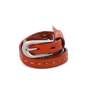 Introducing the Ruby by Bed|Stü: a coiled brown leather belt featuring contrast stitching and a silver metal buckle, showcased against a white background.