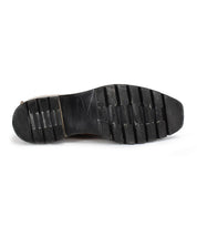 The image shows the black ridged sole of the Bed|Stü Salatiel Chelsea boot, viewed from the bottom against a white background.