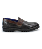 A dark brown leather men's penny loafer, the Samosa by Bed|Stü, features a low heel, rugged black sole, and visible stitching, photographed from the side on a white background.