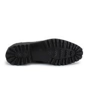 The bottom view of the Bed|Stü Samosa, a black classic loafer, showcases a thick, rugged rubber sole with deep treads for enhanced traction.