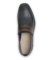 Top view of the Bed|Stü Samosa men's penny loafer, crafted in dark gray leather with brown accents and visible stitching, featuring a Bed|Stü branded insole for classic loafer appeal.