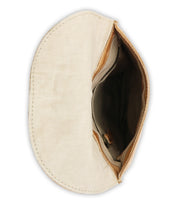 Introducing the Sandy Lane II by Bed|Stü—a beige canvas and vegetable-tanned leather pouch, opened to reveal a spacious interior with a handy pocket and secure snap button. Shown against a white background, this handmade piece skillfully blends natural materials for a distinctive artisan touch.