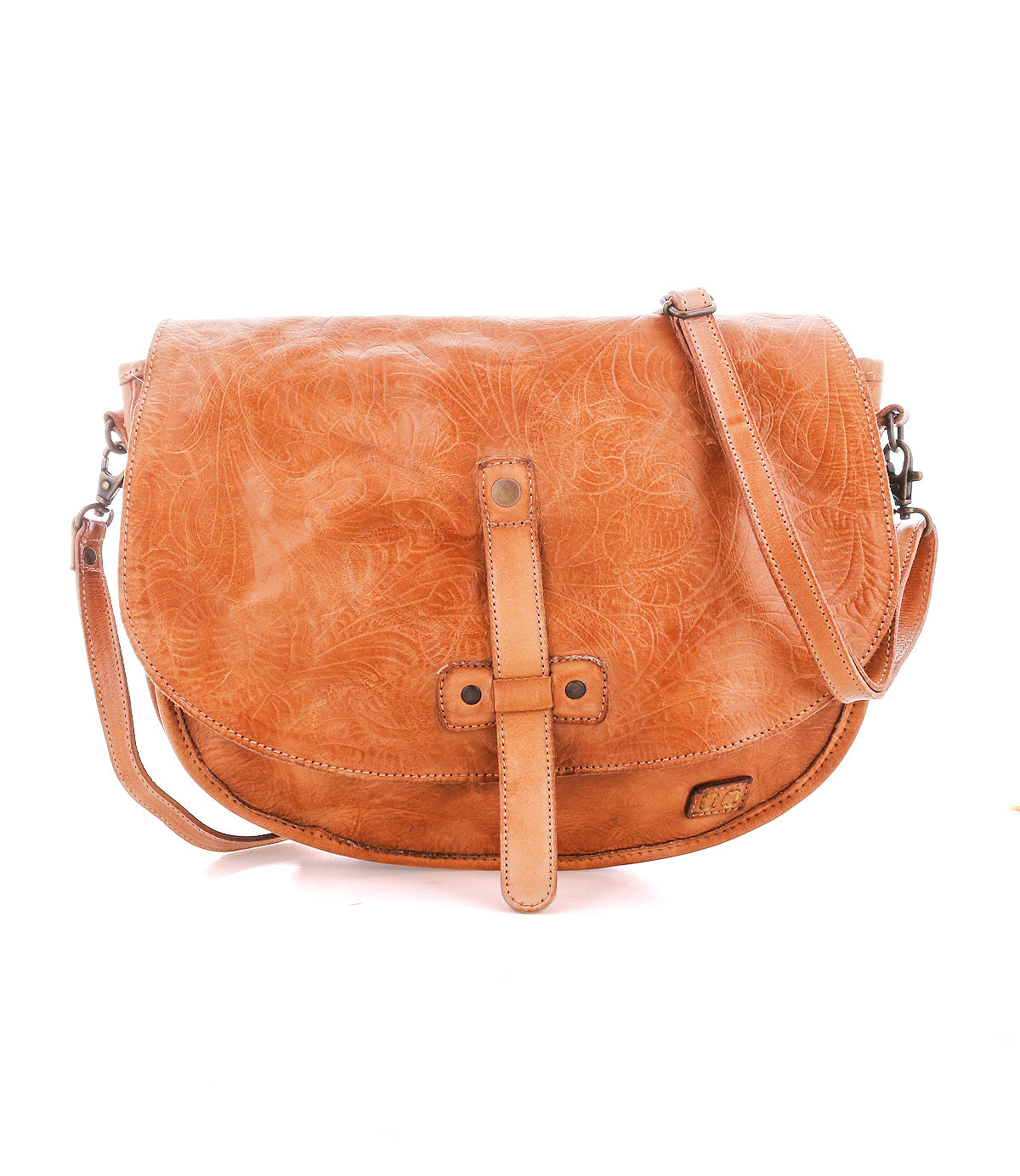 The Bed|Stü Sequoia EM is a tan vegetable-tanned leather crossbody bag featuring a flap closure, detailed embossed pattern, and an adjustable shoulder strap, shown against a plain white background.