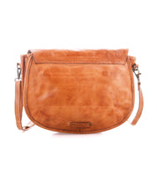 Bed|Stü Sequoia EM is a tan, vegetable-tanned leather crossbody bag featuring a curved flap, visible stitching, and a detachable shoulder strap.