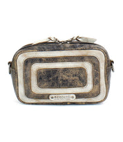 The "Shy" crossbody by Bed|Stü is a rectangular distressed leather bag featuring metallic accents, dual front zippered pockets for convenience, and a subtle Bed|Stü label at the front center—making it the perfect compact accessory for staying stylish and organized.