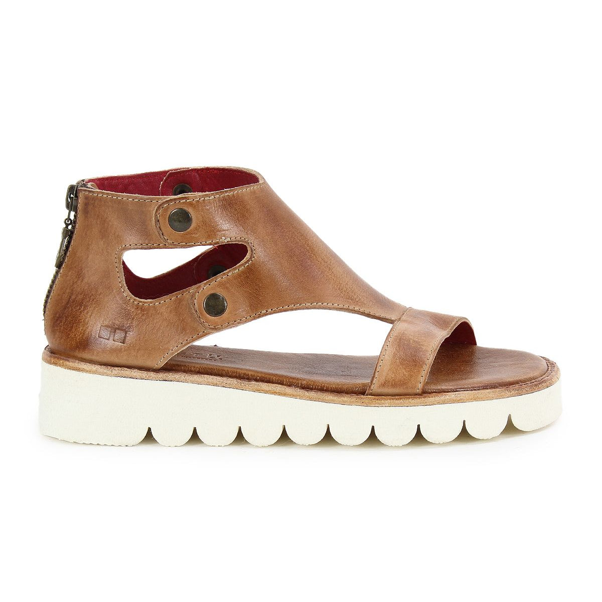 The Bed|Stü Soni II sandal features brown leather construction with a comfortable cutout design, two metal button accents, an open toe, a back zipper, and a white textured durable outsole.