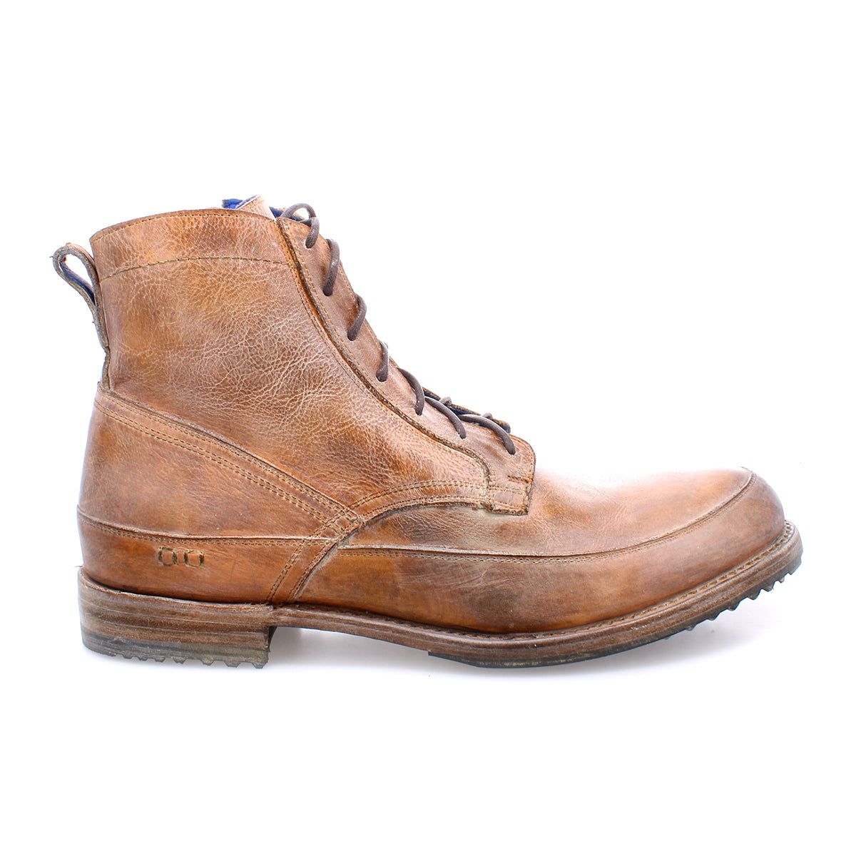 The Bed|Stü Spiker is a brown men’s lace-up boot with a slightly worn look, visible stitching, and a low rubber-heeled sole. It features a cushioned insole for added comfort and is photographed from the side on a white background.