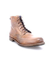 A single Bed|Stü Spiker men’s lace-up boot in brown leather, showing visible wear and classic design details, is photographed on a white background. This sturdy leather ankle boot features a cushioned insole for added comfort.