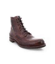 The Bed|Stü Spiker is a single men’s lace-up leather ankle boot with visible stitching, a rounded toe, and a textured rubber sole displayed on a white background; it features a cushioned insole for added comfort.