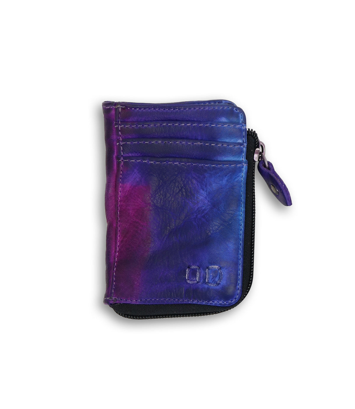 Introducing the Bed|Stü Carrie—a compact leather wallet featuring a purple and blue tie-dye pattern with two convenient card slots on the front. This stylish piece boasts a secure zip compartment along its edge, all showcased against a clean white background.