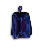Discover the Carrie by Bed|Stü—a small purple leather coin purse featuring two compartments, a secure black zipper, and a snap button closure. Shown on a white background, this compact wallet offers convenient card slots and a zip compartment to keep your essentials organized and safe.
