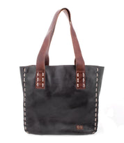 The Stevie tote by Bed|Stü is a vintage-inspired black leather bag featuring brown shoulder straps and visible stitching along the sides and handles, perfect for everyday carry, shown against a white background.