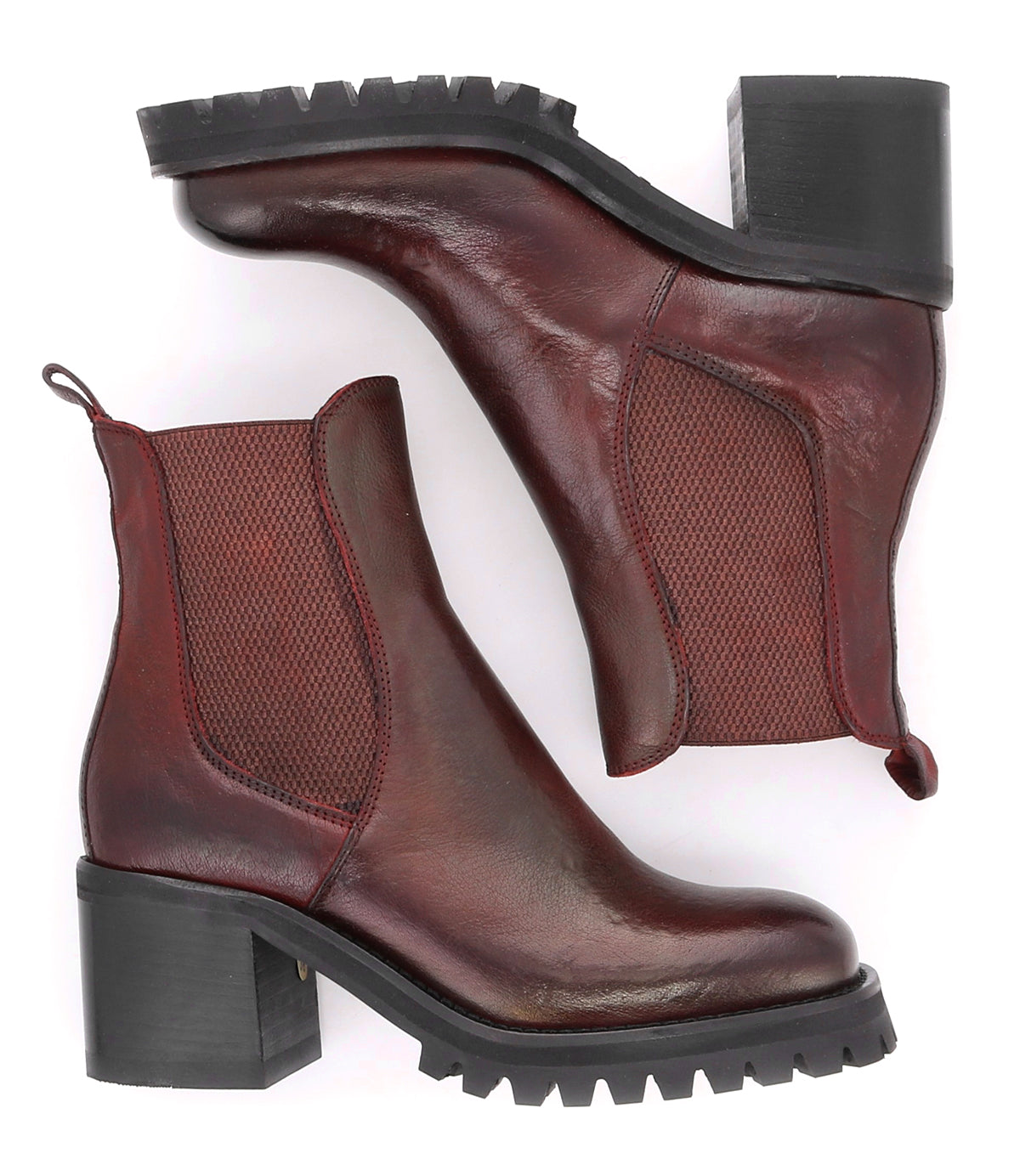 Surge Chelsea boots by Bed|Stü in dark red Italian leather, featuring chunky black heels and elastic side panels, displayed from the side and bottom on a white background.