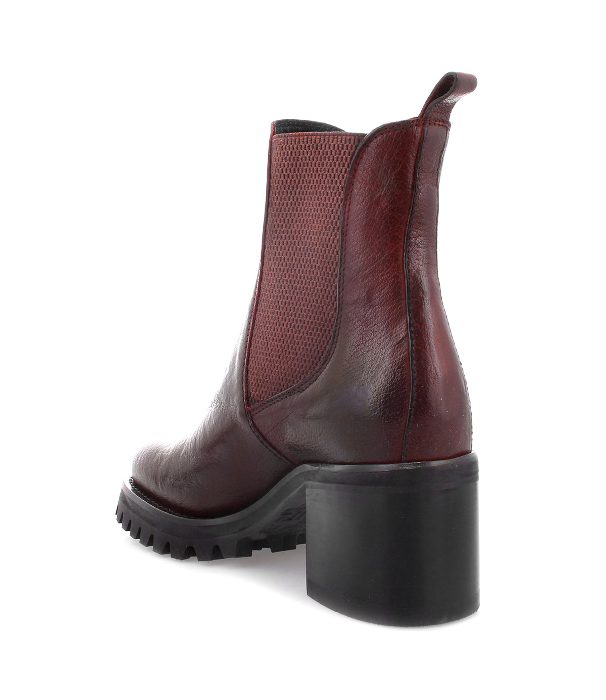 The Surge ankle boot by Bed|Stü is shown as a single, dark red Italian leather boot featuring a modern square toe, chunky black heel, and textured side panels, viewed from the back and slightly to the side.