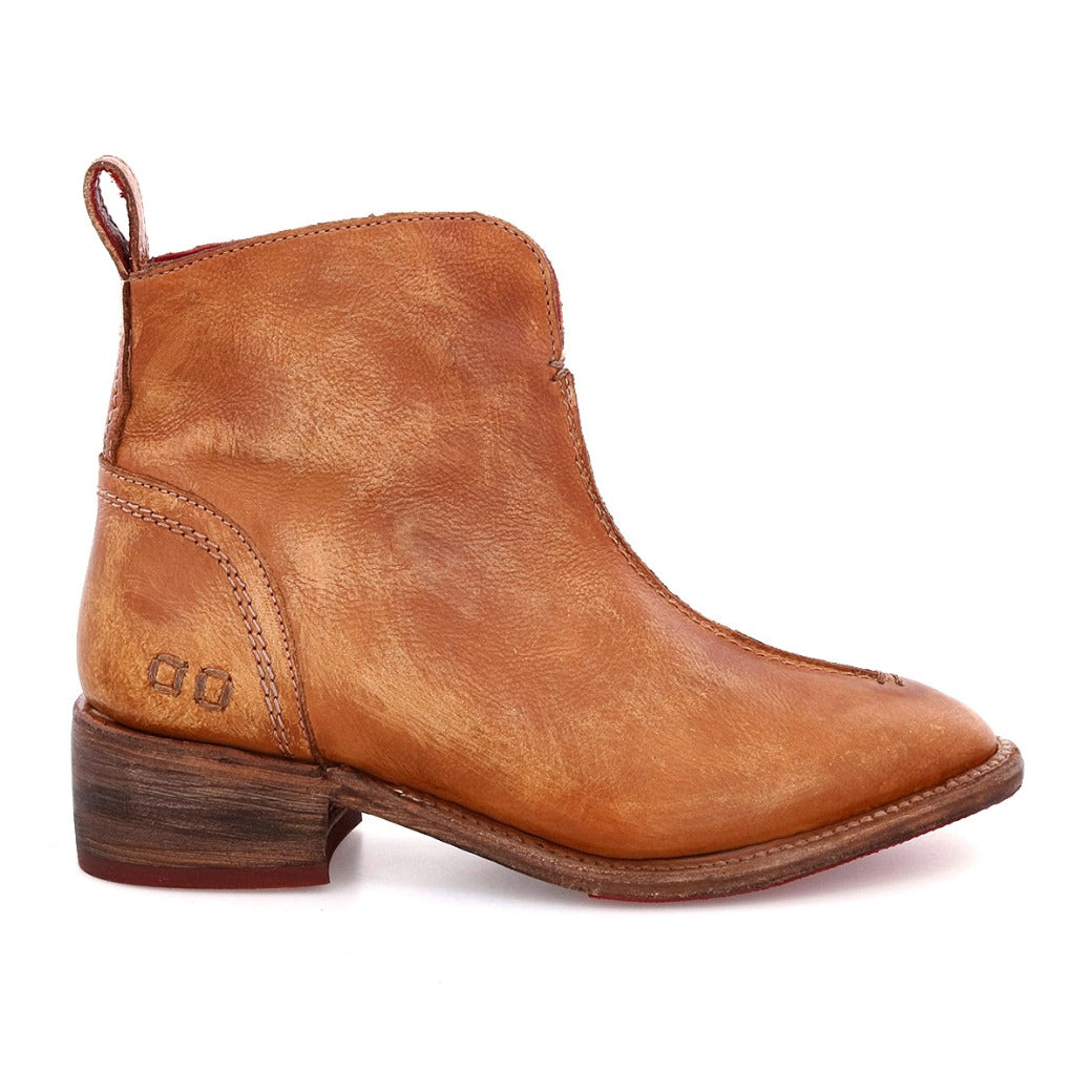 Presenting the Tabitha by Bed|Stü—a single women's short Boot in tan leather, highlighted by its designer-inspired silhouette. This ankle boot showcases a low heel, side stitching details, and a practical pull tab at the back, all beautifully displayed against a clean white background.