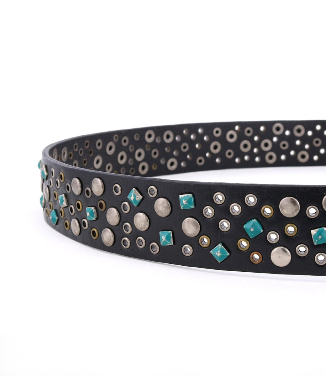 The Tammin belt by Bed|Stü is a black leather, interchangeable buckle belt, embellished with turquoise square studs and an array of silver and gold round metal studs in varying sizes.