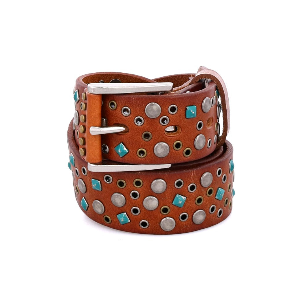 The Bed|Stü Tammin brown leather belt, featuring round silver studs and turquoise square accents with a silver buckle, is rolled up on a white background.