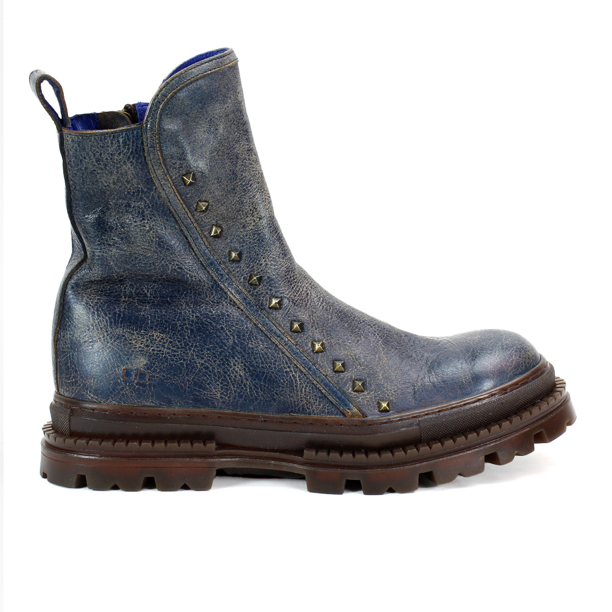 The Tanto boot by Bed|Stü is a streamlined blue design featuring a leather upper, rugged lug outsole, and decorative metal studs along the side.