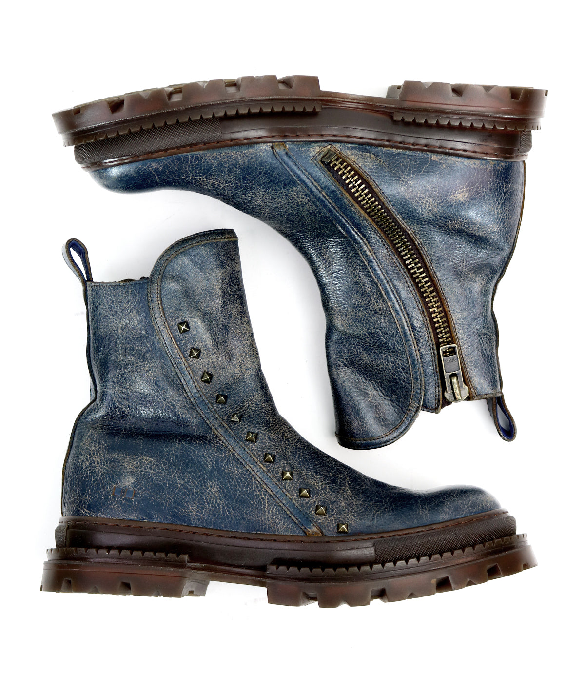 A pair of worn blue Bed|Stü Tanto leather boots with a streamlined silhouette, brown soles, metal studs, and a visible side zipper, arranged side by side on a white background.