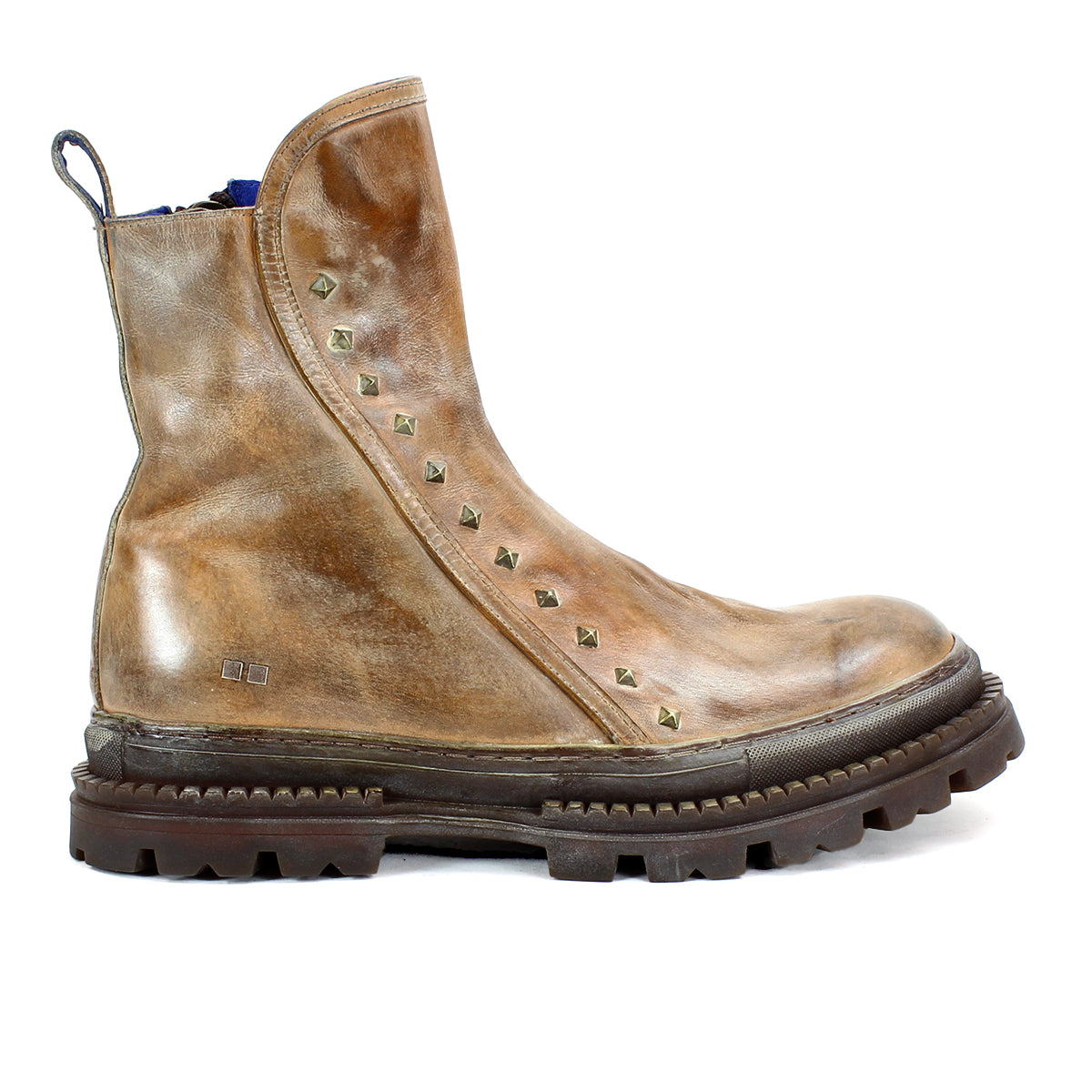 The Bed|Stü Tanto is a brown leather ankle boot featuring metallic studs along the side, a thick lug outsole for enhanced durability, and a pull tab at the back, shown here in left side profile.