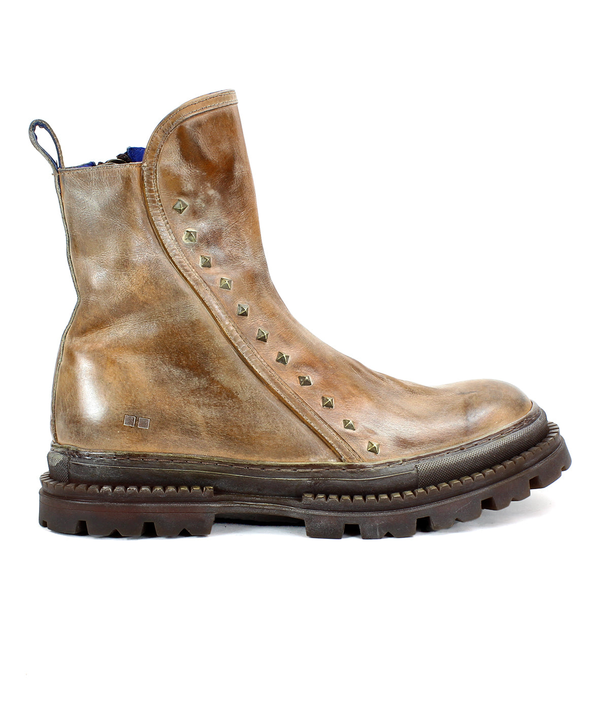 The Bed|Stü Tanto is a brown leather ankle boot featuring metallic studs along the side, a thick lug outsole for enhanced durability, and a pull tab at the back, shown here in left side profile.