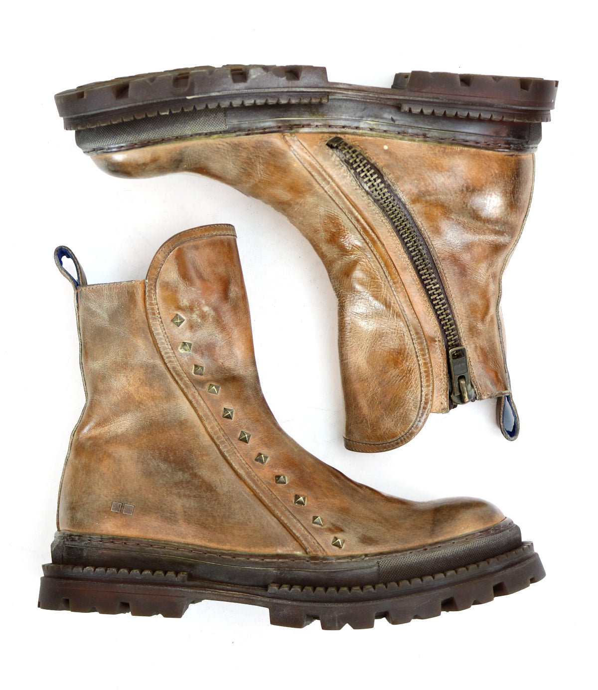 A pair of Bed|Stü Tanto worn brown leather boots featuring side zippers, metal studs, chunky lug soles, and noticeable signs of use.