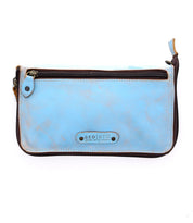 The Templeton II by Bed|Stü is a light blue leather crossbody wallet featuring brown trim, a front zipper pocket, and a metal plate with the "Bed|Stü" logo on the front. Its subtly distressed texture blends rugged elegance with the versatile function of a clutch.