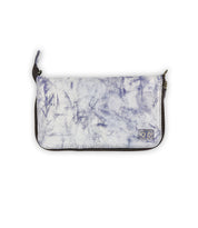 Introducing the Templeton II by Bed|Stü—a rectangular clutch purse featuring a blue and white marbled pattern, dark edges, a zipper closure, and a small fabric logo patch in the bottom right corner. Perfect for carrying solo as a stylish clutch or slipping into your favorite leather crossbody bag for added organization.