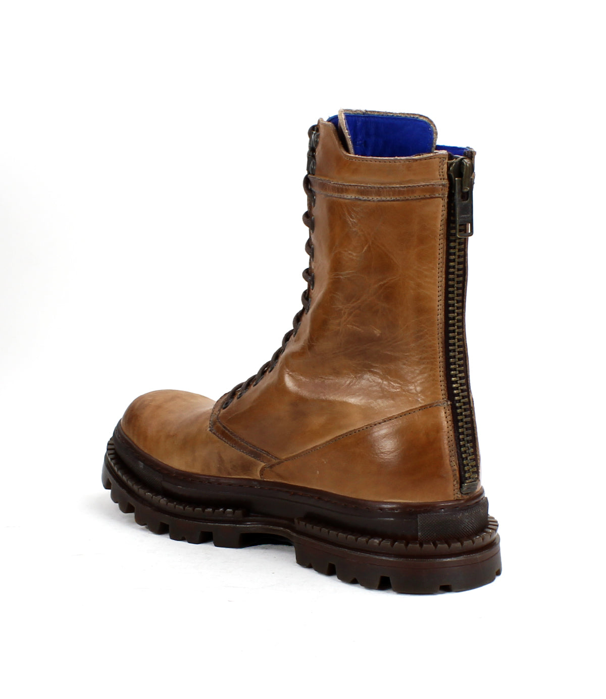 The Bed|Stü Tempt boot, a brown leather lace-up with side zipper and blue lining, is pictured from the back on a white background—an effortlessly stylish hybrid that combines classic hiking boot durability with Chelsea boot-inspired sophistication.