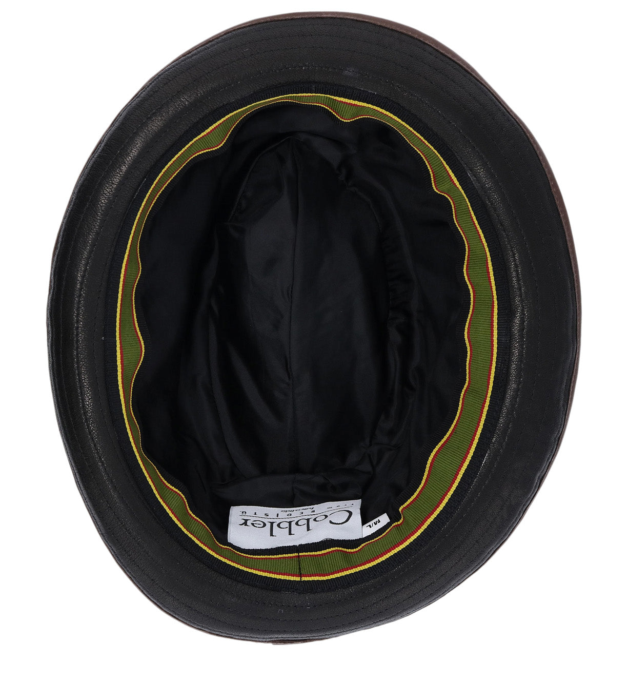 Here’s a rewrite using your product data: Top view of the inside of the Turino black bucket hat by Bed|Stü, featuring a green and yellow inner rim and a white label on the interior. This lightweight, crushable design ensures comfort and easy packing for effortless, on-the-go style.