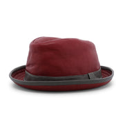 The Bed|Stü Turino is a maroon fedora hat featuring a dark gray band and brim, crafted from lightweight materials for comfortable wear, and displayed against a plain white background.