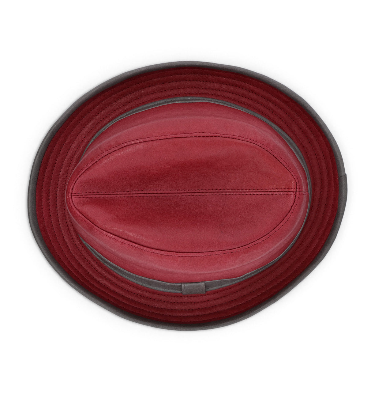 Crushable and lightweight, the Turino bucket hat by Bed|Stü is handmade from red leather and shown from above against a white background, highlighting its stitched panels and dark brim.