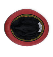 Top-down view of the inside of the Turino bucket hat by Bed|Stü in red, black, and green, featuring a lightweight black inner lining and a visible "Bed|Stü" brand label.