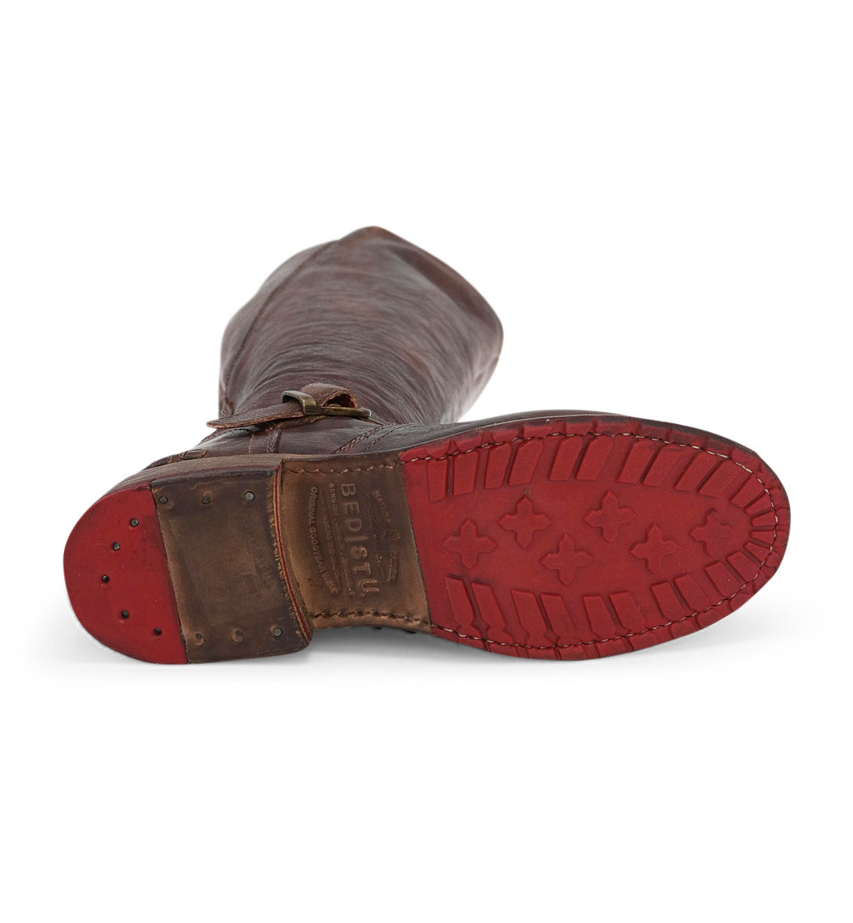 The Glaye Wide Calf boot by Bed|Stü is a tall brown leather boot shown sole-up, highlighting a textured red rubber outsole with cross-shaped treads and visible stitching.