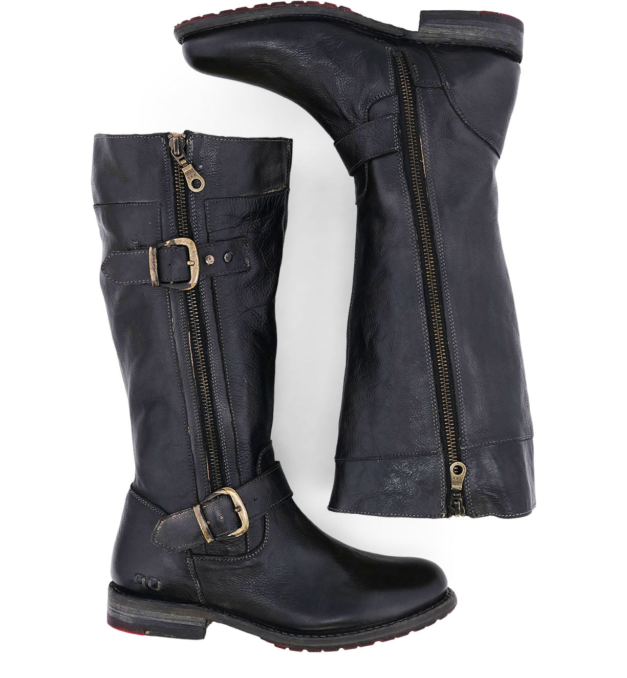 A pair of Bed|Stü Gogo Lug Wide Calf boots shown from a side and bottom view, featuring tall black leather uppers, side zippers, decorative buckles, low stacked heels, and a classic engineer boot silhouette.