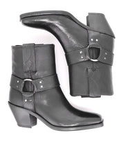 A pair of Vamoose black Italian leather cowboy ankle boots by Bed|Stü, featuring side decorative straps and silver buckles in a classic harness-boot style, shown from the side and top views.