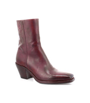The Vendue by Bed|Stü is a single maroon ankle boot, expertly crafted from luxurious Italian leather with a rounded square toe and a chunky mid-height heel, displayed against a white background.