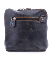 A well-loved Bed|Stü Ventura black leather crossbody bag featuring a front exterior zip pocket and visible scuff marks, photographed against a white background.