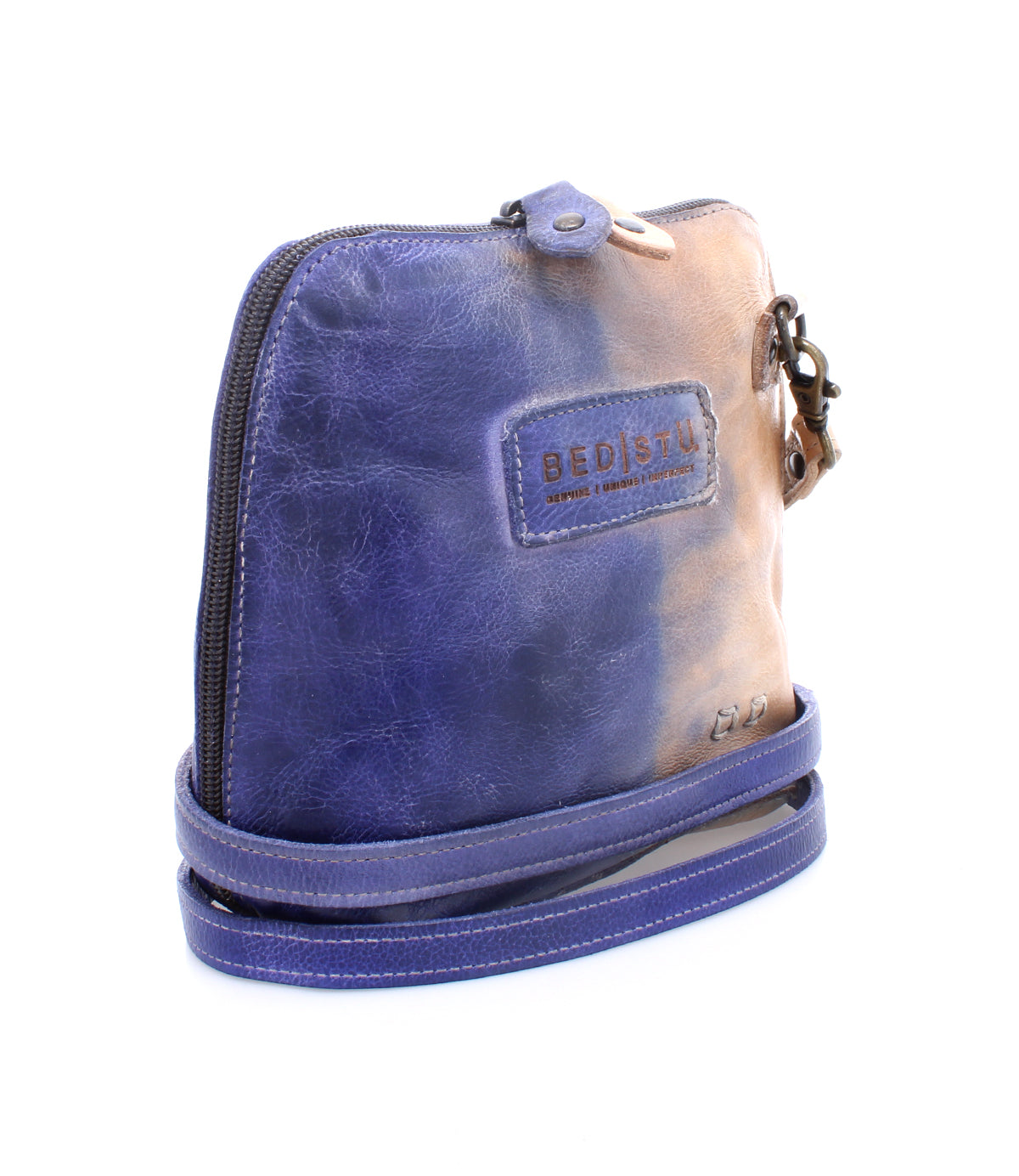 Introducing the Ventura by Bed|Stü—a small leather crossbody bag featuring a striking blue and tan gradient finish. Designed with a secure zipper closure, embossed "Bed|Stü" logo, convenient exterior zip pocket, and an attached matching strap, this lightweight purse seamlessly blends style and functionality for everyday use.