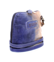 Introducing the Ventura by Bed|Stü—a small leather crossbody bag featuring a striking blue and tan gradient finish. Designed with a secure zipper closure, embossed "Bed|Stü" logo, convenient exterior zip pocket, and an attached matching strap, this lightweight purse seamlessly blends style and functionality for everyday use.