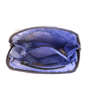 Discover the Bed|Stü Ventura—an open, empty lightweight purse featuring a purple fabric lining, an interior zipper pocket, and a leather strap inside—making it the perfect stylish leather crossbody bag.