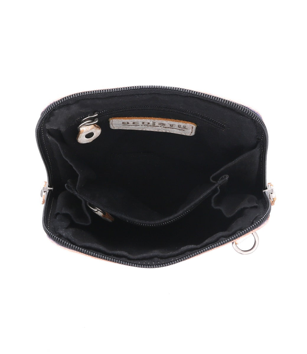 The Bed|Stü Ventura black leather crossbody bag is shown from above against a white background, revealing multiple inner compartments, a zippered pocket, a key hook, and an interior label. This lightweight purse also includes an exterior zip pocket for added convenience.