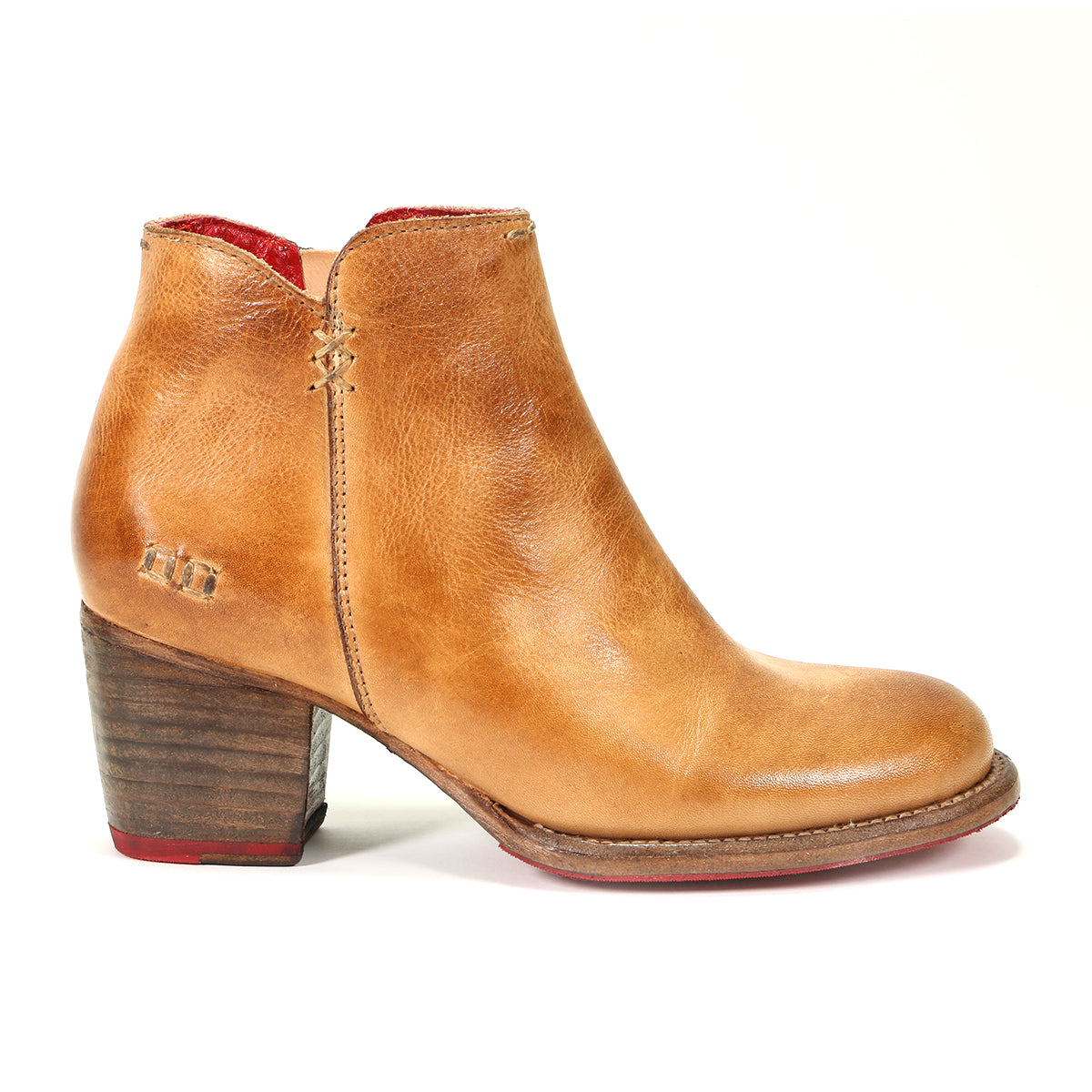 The Bed|Stü Yell is a pair of light brown handmade leather ankle boots with a stacked wooden heel, red inner lining, visible stitching details, and a durable Vibram outsole, displayed on a white background.