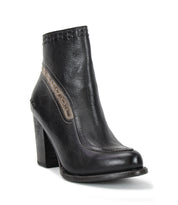 The Yuno high-heeled ankle boot by Bed|Stü is crafted in black leather with a rounded toe, decorative stitching, and a gray accent stripe on the side, featuring contrast leather accents for added visual interest and elevated style.