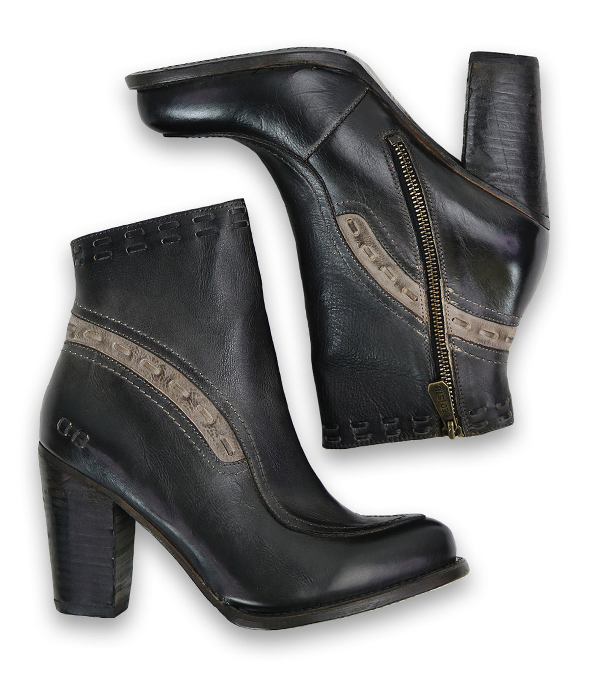 A pair of Bed|Stü Yuno black elevated heel boots with side zippers and decorative stitching detail, featuring contrast leather accents, displayed from the side and bottom views.